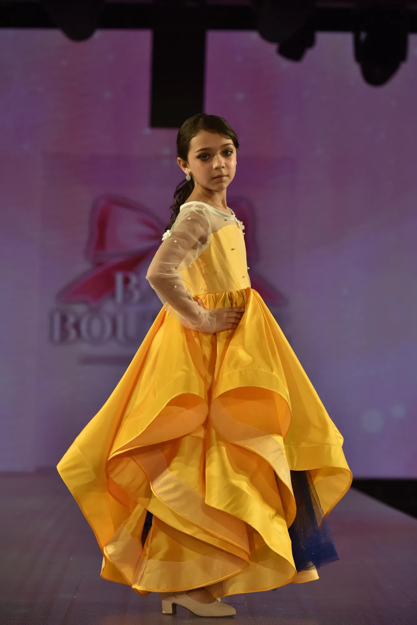 Marigold organza gown with pearl-set sleeves — Babs Boutique, Orlando Monroy Memorial Artist Collaboration Collection, New York Fashion Week