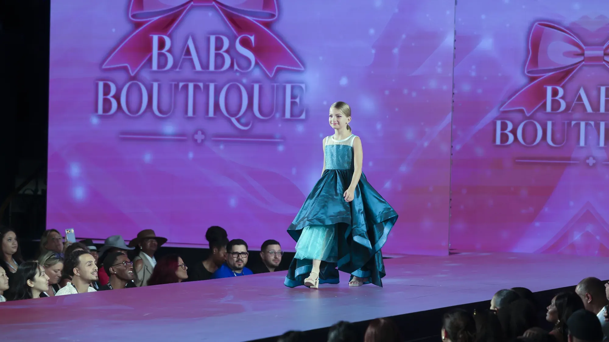 Teal tiered gown — Babs Boutique, Orlando Monroy Memorial Artist Collaboration Collection, New York Fashion Week