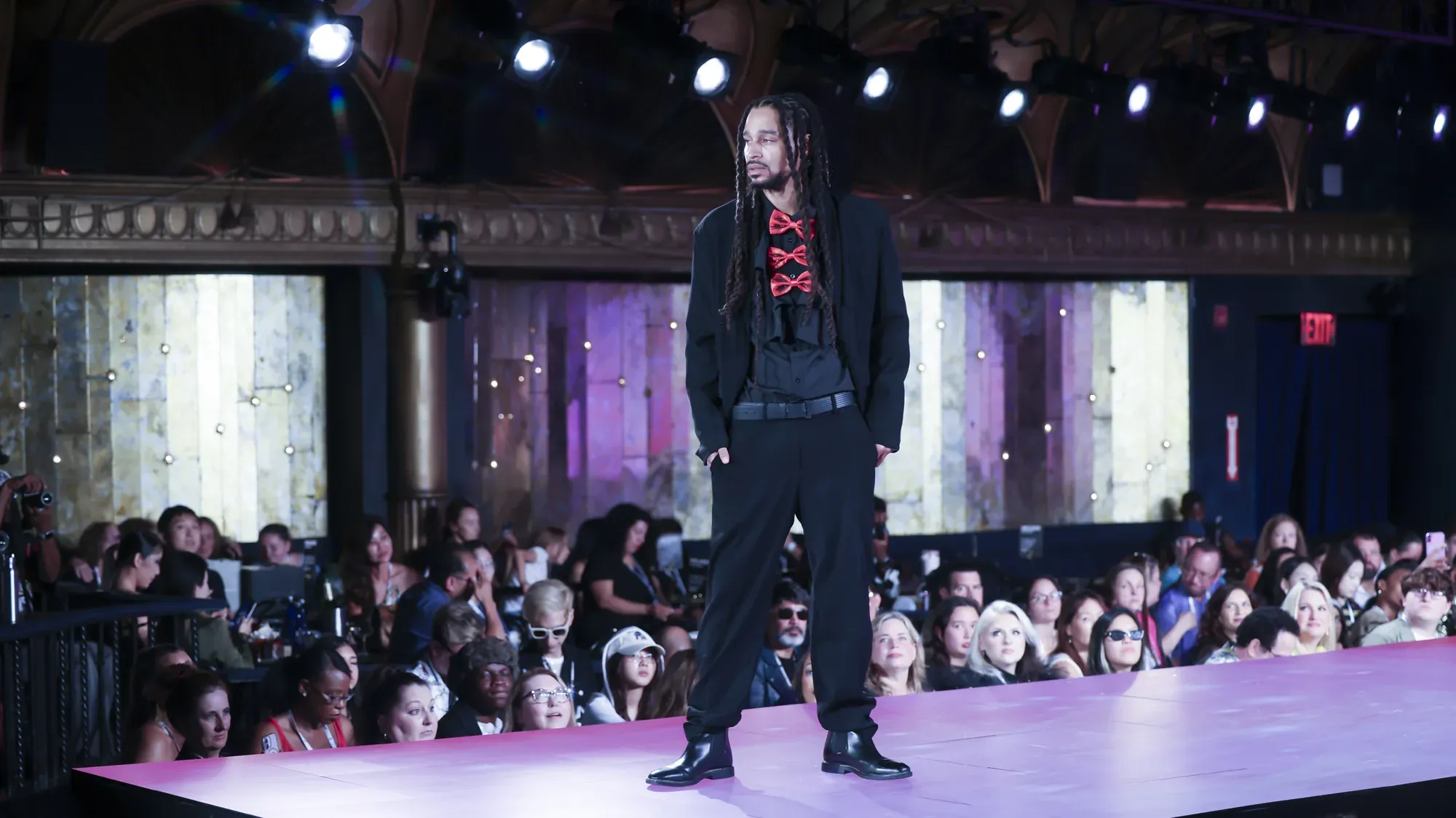 Black suit with red bow tie — Babs Boutique, Orlando Monroy Memorial Artist Collaboration Collection, New York Fashion Week