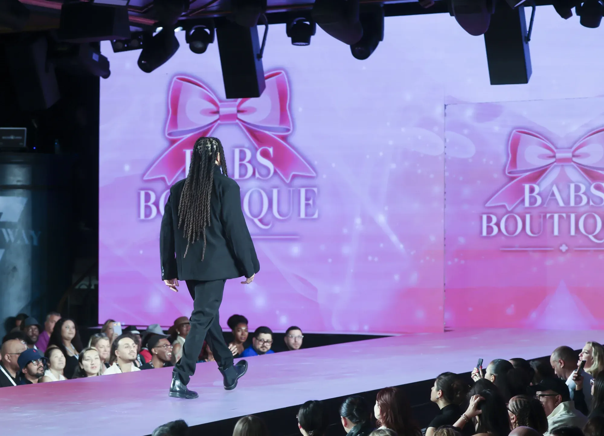 Black suit with red bow tie — Babs Boutique, Orlando Monroy Memorial Artist Collaboration Collection, New York Fashion Week