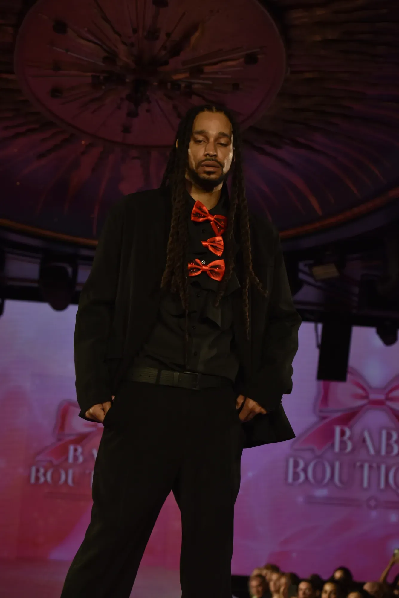 Black suit with red bow tie — Babs Boutique, Orlando Monroy Memorial Artist Collaboration Collection, New York Fashion Week